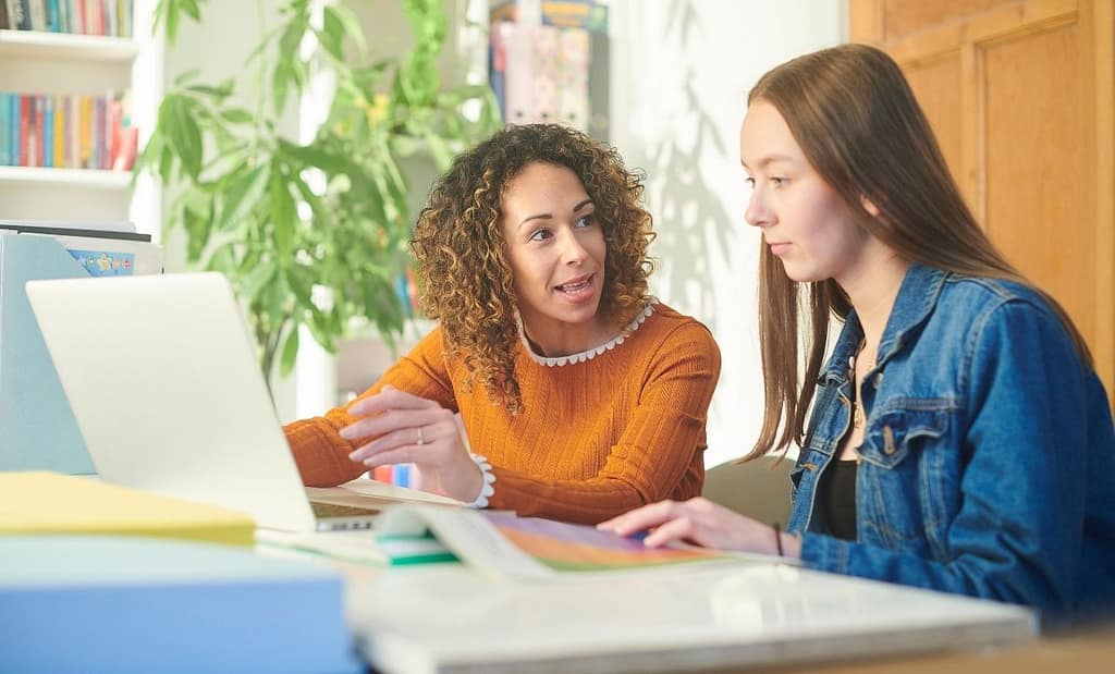 Image of a student and an advisor making a graduation plan.