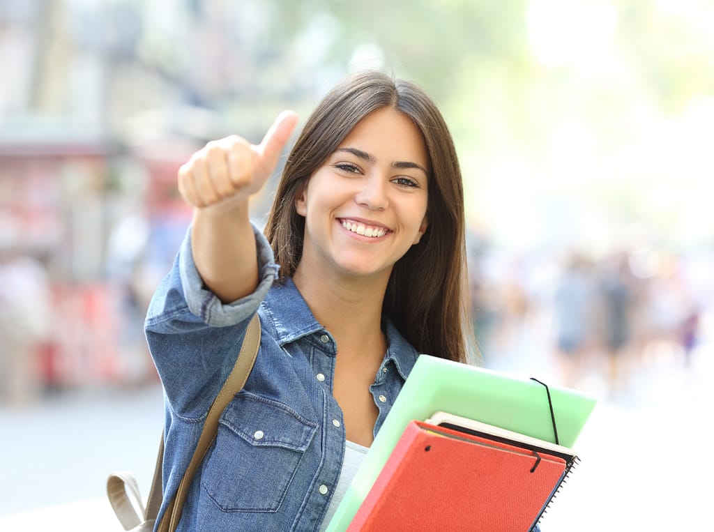 Smiling female international student in the United Kingdom.