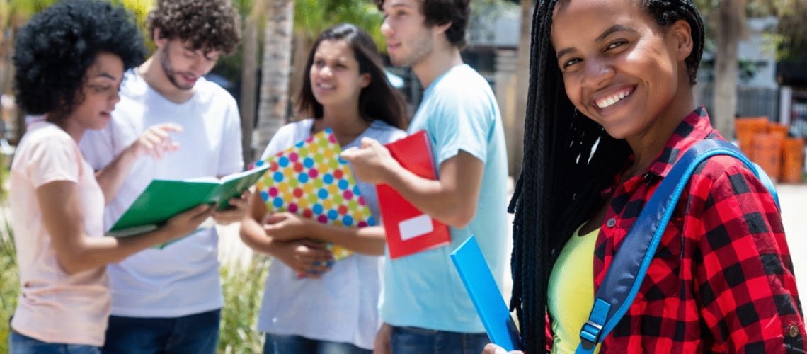 Picture of a smiling Nigerian Student at University.